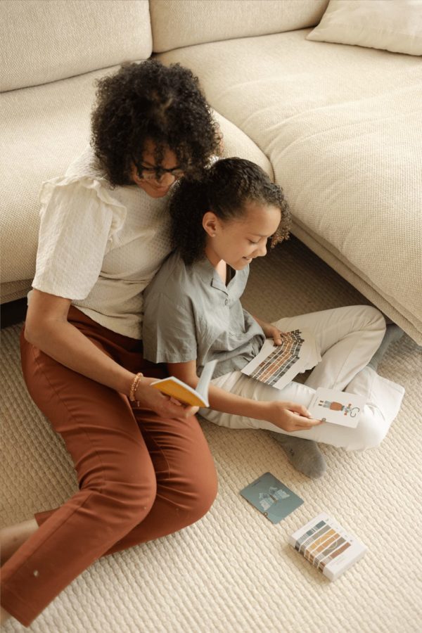 A mother and her child doing a card reading together